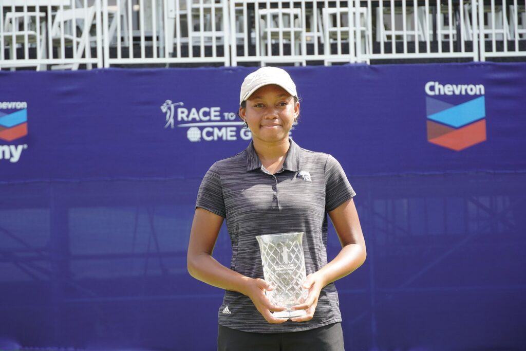 Alaythia Hinds with trophy after winning 2023 Mack Champ Invitational