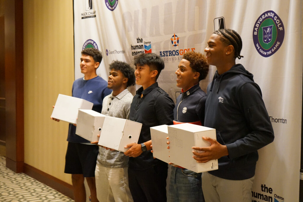 players holding shoe boxes